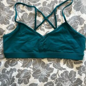 Teal Alo sports bra with mesh center